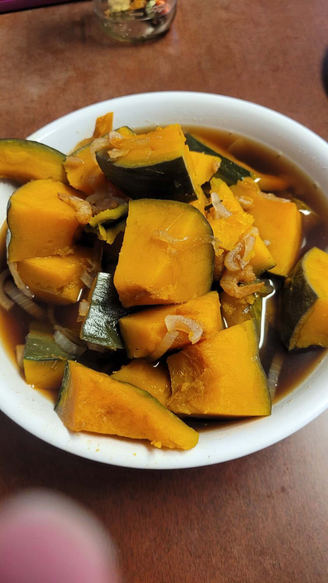 A bowl of squash with onions and other ingredients
