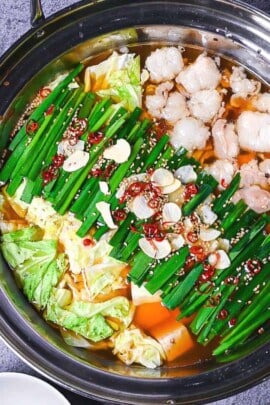 Motsunabe in an aluminum pot made with beef intestines, cabbage and tofu served in an aluminum pot