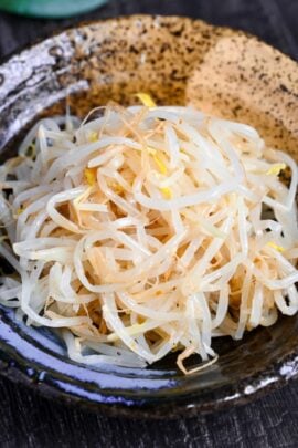 Seasoned Bean Sprouts for ramen in a black and beige Japanese-style bowl