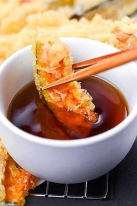 Kabocha tempura dipped in homemade tentsuyu tempura dipping sauce